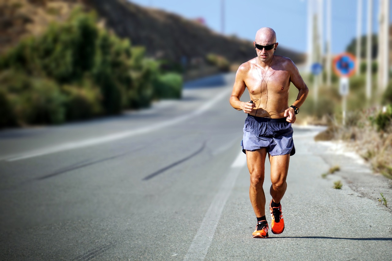 man jogging on the side of the road
